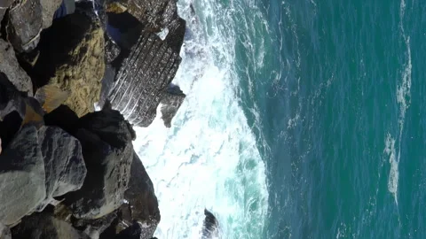 Huge waves break on the coastal cliffs Stock Footage 263725260
