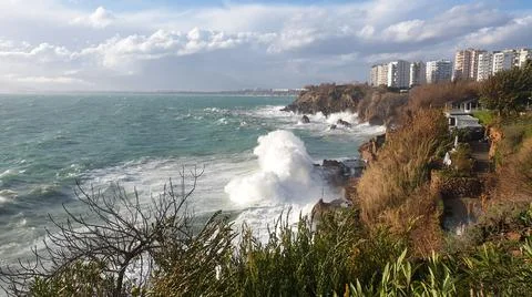 Huge waves break on the shore Stock Photos