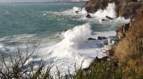 Huge waves break on the shore Stock Photos