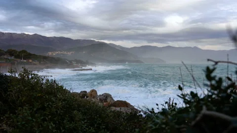 Huge waves break on the stone coast Stock Footage 102759521