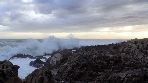 Huge waves break on the stones Stock Footage 102730644