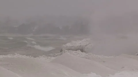 Huge waves breaking in blizzard on cold windy winter day Stock Footage 45637150