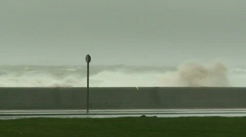 Huge waves breaking over sea wall 6 Stock-Footage 673549