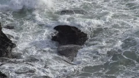 Huge waves colliding with rocks Stock Footage 12105534