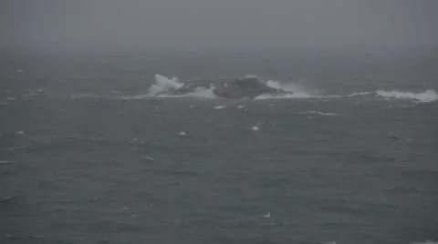 Huge waves crashing over small island Stock-Footage 46060258