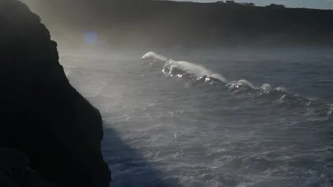 Huge waves hitting the cliff and exploding Stock Footage 256086288