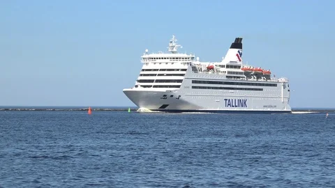 Huge white ferry sails on vast water area under blue sky Stock Footage 113091376