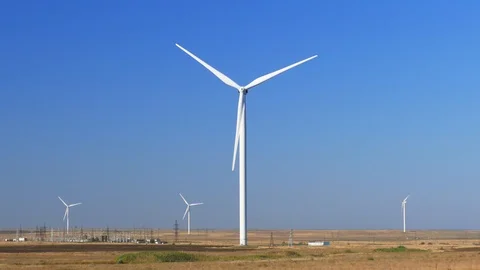 Huge wind generator on blue sky background Stock Footage 116051459