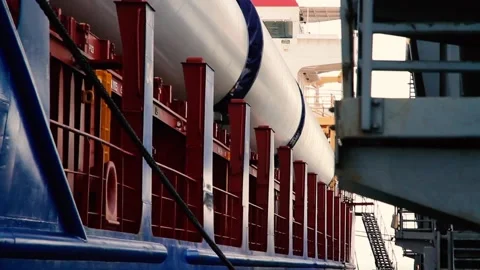Huge windmill blade for environmental energy lies on a large delivery freighter  Stock Footage 224747829
