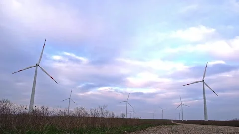 Huge windmill generator turbines. Alternative energy. Stock Footage 190099982