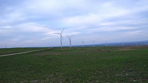 Huge windmill generator turbines. Alternative energy. Stock Footage 190100608