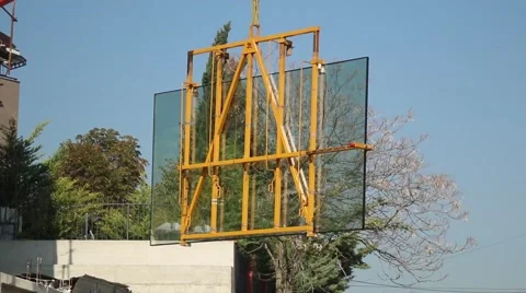 Huge Window Glass Construction Work Building Hoist Crane House Workers Company Video stock 68419061