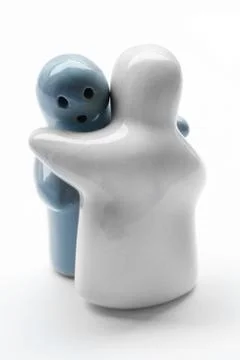 Hugging ceramic dolls. Stock Photos