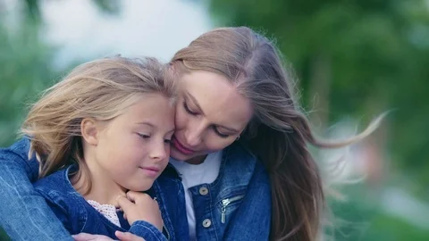 Hugging mother and daughter Stock Footage