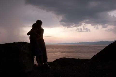 Hugging in the storm Stock Photos