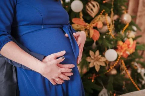 Hugs pregnant belly man's hand Stock Photos