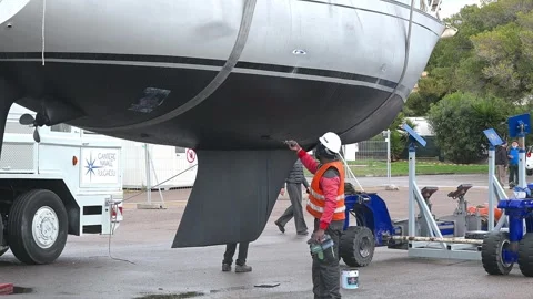 Hull maintenance before crane launch of sailboat Stock Footage 310513680