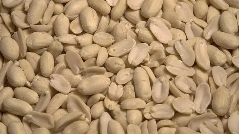 Hulled Unsalted Raw Peanuts in Halves Rotating on Turntable. Organic Healthy Video stock 92201318