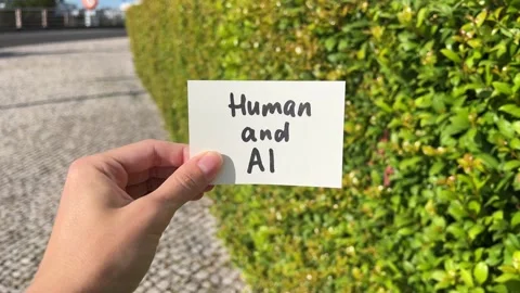 Human and AI - text in hand, artificial intelligence concept Stock Footage 338418955