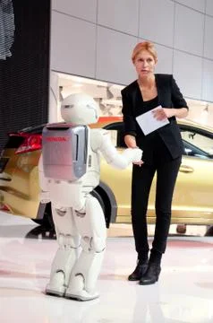 Human and robot are shaking hands Stock Photos