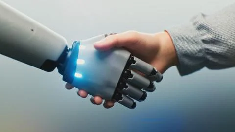Human and Robotic Hand Shaking, Glowing With Digital Light Stock Photos