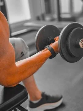 Human arm doing weight training Stock Photos