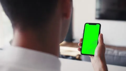 Human arms hold electronics gadget with chromakey touchpad closeup. Guy Stock Footage 138903904