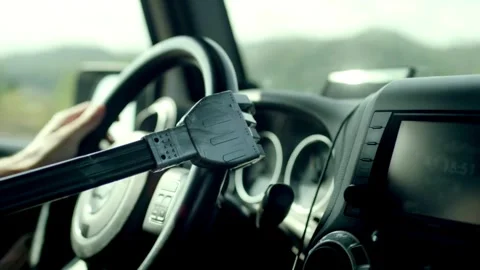 Human with artificial robotic arm holding steering wheel and driving vehicle. Stock-Footage 336266119