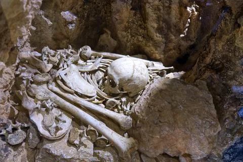 Human bones inside an ancient underground burial Stock Photos