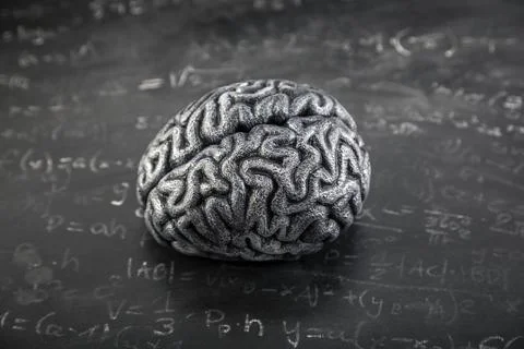 Human brain model with mathematical equations on old school chalkboard Stock Photos