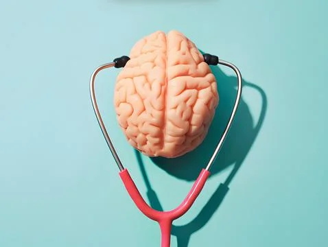 Human brain model with a pink stethoscope on blue Stock Photos