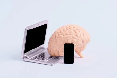 Human Brain Using Miniature Laptop and Smartphone 스톡 사진