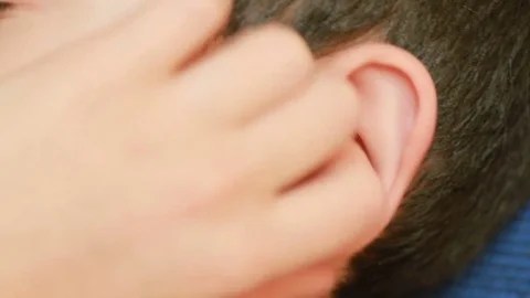 Human child ear close up. earache, otitis. Child touches a sore ear Video stock 71818543