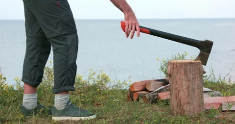 Human chops wood with an ax. Stock Footage 157855233