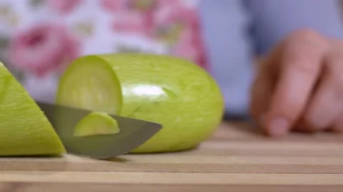 Human cuts fresh vegetables for preparing vegetarian dish, pathetically swipes Stock Footage 144314914