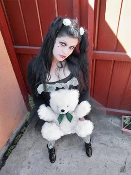 Human doll with a stuffed bear Stock Photos