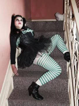 Human doll throwed on stairs Stock Photos