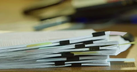Human dropping a stack of sheets on a desk at the office. A lot of work. Video stock 236924634
