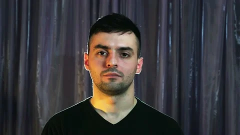 Human emotions, a guy with a serious expression on his face Stock Footage 237273797