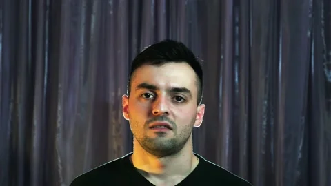 Human emotions, the man first smiles then gets angry Stock Footage 237274120