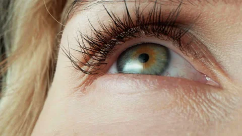 Human eye close-up with green iris. Women without make-up on face Stock Footage 310181257