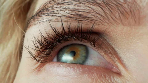 Human eye close-up with green iris. Women without make-up on face Stock Footage 310181440