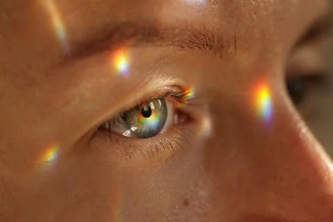 Human eye close up with rainbow reflection for vision health concepts Stock Photos