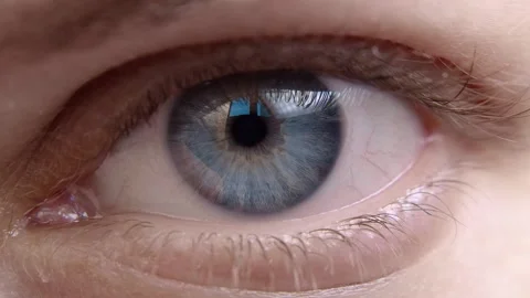Human eye iris opening pupil close up slow motion. Stock Footage 168318671