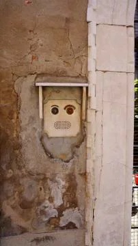 Human face shape doorbell Stock Photos