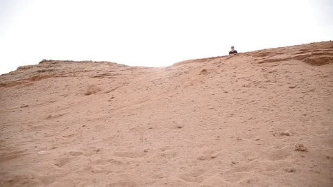 Human fell from sand dunes Video stock 89850190