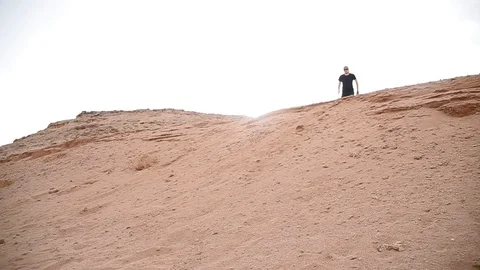 Human fell from sand dunes Video stock 89850247