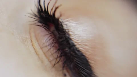 The human female eye opens and closes. macro Stock Footage 200823130