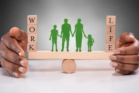 Human Figure Standing Between Work And Life Wooden Blocks Stock-Fotos