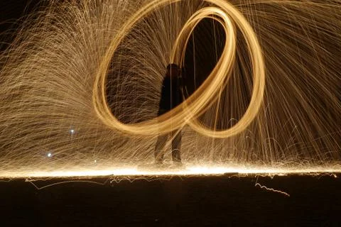 Human figure through lights and fire, steel wool Stock Photos